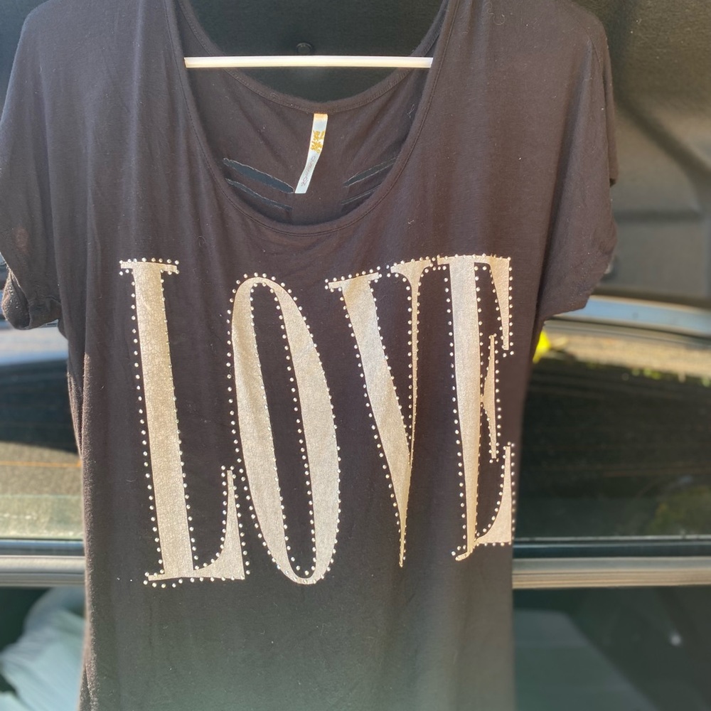 Womens black shirt with love on it Sequence around the lettering